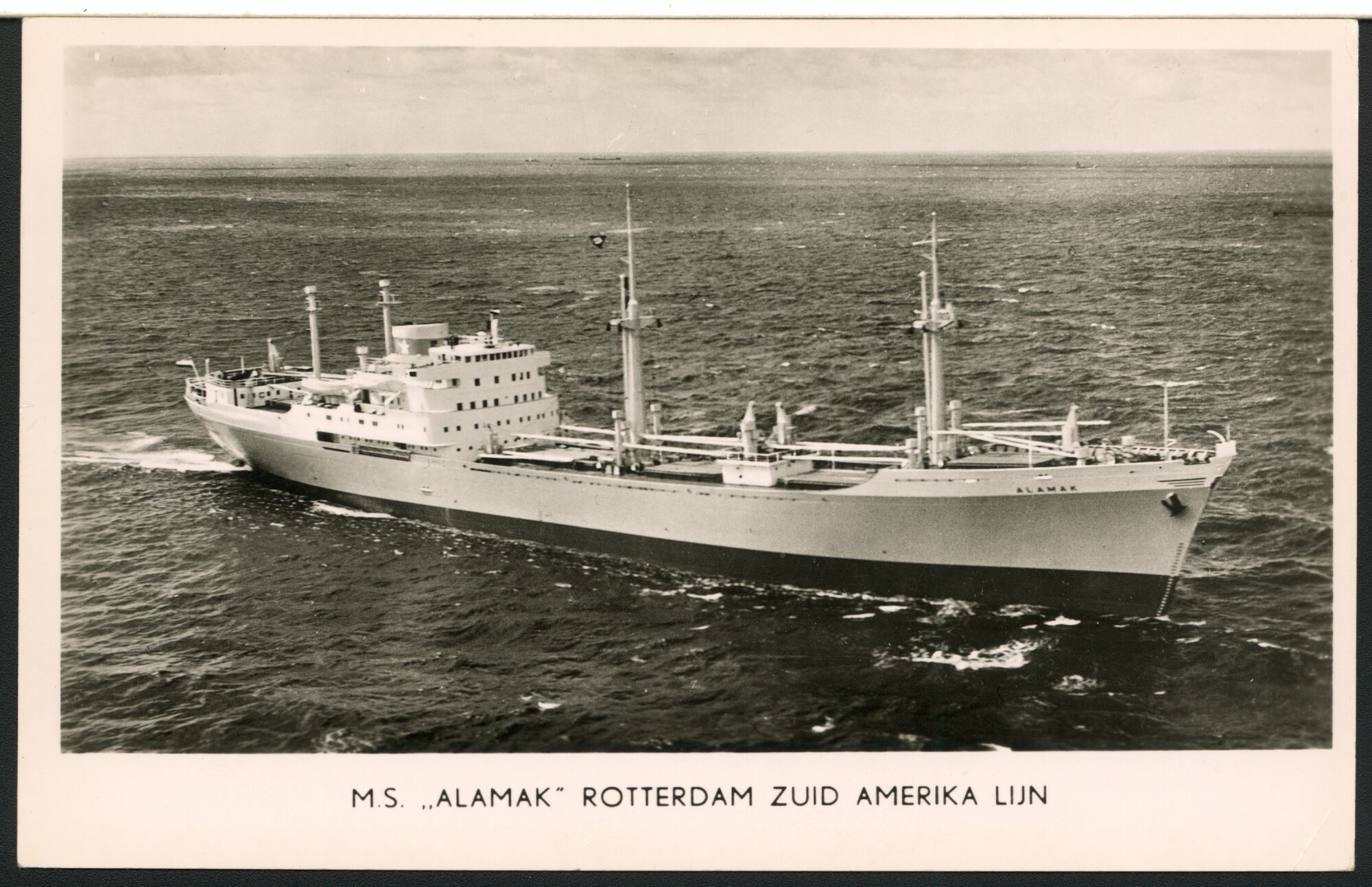 S.6408(0335); Een luchtfoto van het vrachtschip ms. Alamak; prentbriefkaart