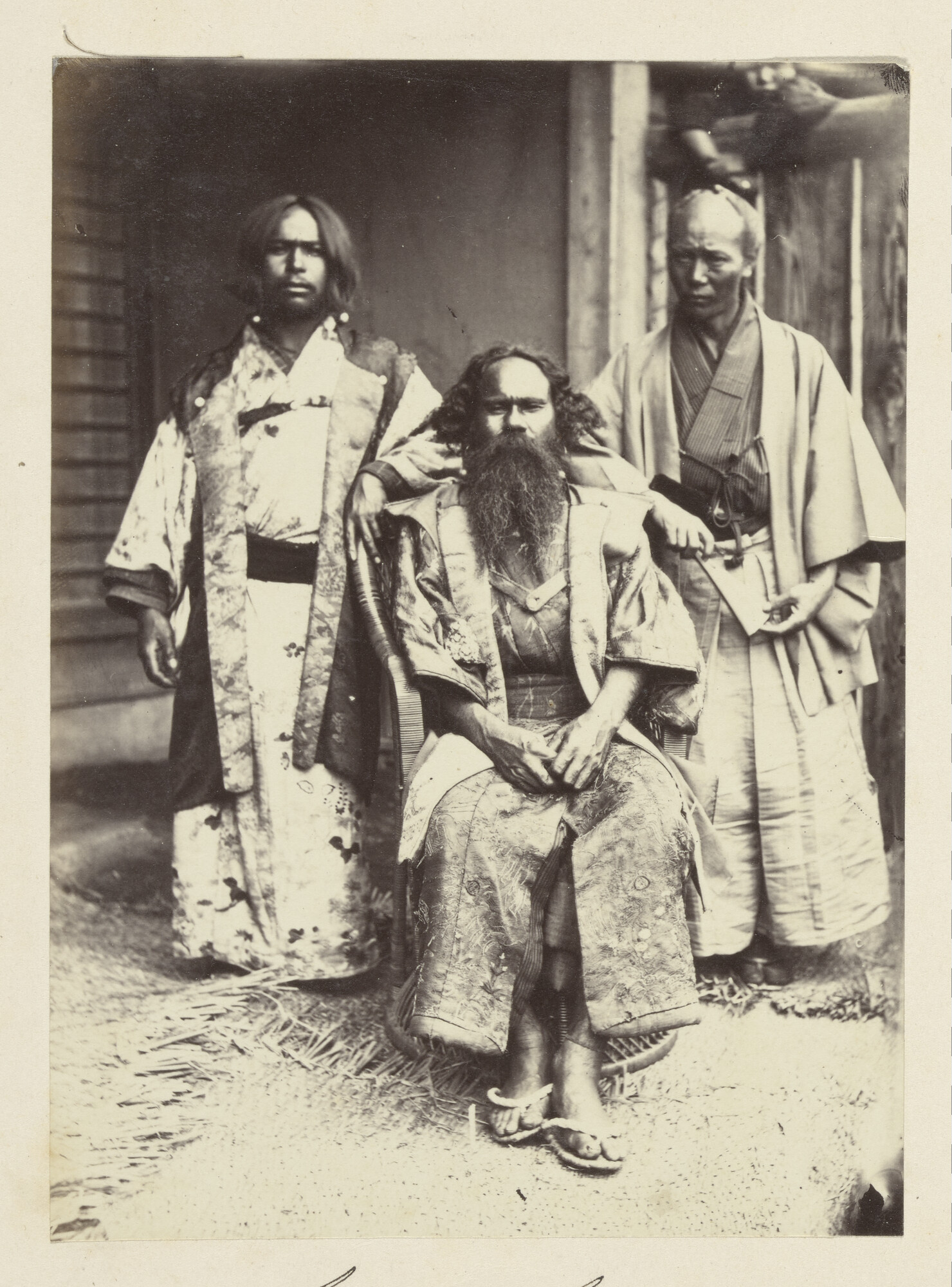 S.3628(04)023; Groepsportret van drie Ainu, de oorspronkelijke bewoners van het eiland Hokkaido ; foto