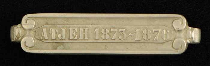 S.1277(11)11 ; Losse gesp met opschrift "Atjeh 1873 - 1876"; onderscheiding